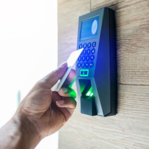 Door access control. Staff holding a key card to lock and unlock door at home or condominium Door access control. Staff holding a key card to lock and unlock door at home or condominium
