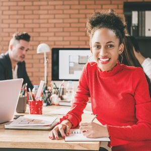 Black businesswoman in office with her colleagues Black businesswoman in office with her colleagues